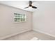 Bright bedroom with a ceiling fan and light gray floors at 810 22Nd N St, St Petersburg, FL 33713
