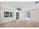 Spacious living room with laminate floors, large windows, and a view of the home's design at 810 22Nd N St, St Petersburg, FL 33713
