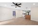 Open floor plan with living room and kitchen, laminate floors and modern lighting fixtures at 810 22Nd N St, St Petersburg, FL 33713
