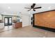 Open-concept floor plan with laminate floors connecting the living room and the modern kitchen at 810 22Nd N St, St Petersburg, FL 33713
