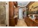 Bathroom featuring a vanity with granite counters and dark wood cabinets at 8711 Brooke Angela Dr, Odessa, FL 33556
