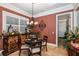 Cozy dining room with a chandelier, buffet, and travertine flooring at 8711 Brooke Angela Dr, Odessa, FL 33556