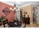 Dining room features a chandelier, stylish decor and an adjacent pantry at 8711 Brooke Angela Dr, Odessa, FL 33556