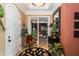 Welcoming foyer featuring elegant decor, tile flooring, and a view into the living space at 8711 Brooke Angela Dr, Odessa, FL 33556