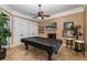 Game room featuring a pool table, tile flooring, and a ceiling fan with lighting at 8711 Brooke Angela Dr, Odessa, FL 33556