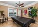 Spacious game room featuring a pool table, ceiling fan and lovely views at 8711 Brooke Angela Dr, Odessa, FL 33556
