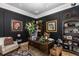 Stylish home office with dark walls, custom bookshelves, and a large executive desk at 8711 Brooke Angela Dr, Odessa, FL 33556