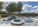 Beautiful pool with a spa, rock feature, and sundeck overlooking the serene lake at 8711 Brooke Angela Dr, Odessa, FL 33556