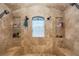 Luxurious walk-in shower with a bench and a rainfall showerhead at 8711 Brooke Angela Dr, Odessa, FL 33556