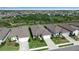 Aerial view of a residential neighborhood featuring well-manicured lawns and coordinated home designs at 8724 Ocean Tides Cv, Parrish, FL 34219