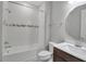Bathroom features a tub with shower and vanity with white countertop at 8724 Ocean Tides Cv, Parrish, FL 34219