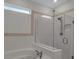 Bathroom showcasing a soaking tub, glass-enclosed shower with rainfall shower head and subway tile at 8724 Ocean Tides Cv, Parrish, FL 34219