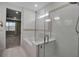 Bathroom featuring a soaking tub, glass-enclosed shower, and neutral paint at 8724 Ocean Tides Cv, Parrish, FL 34219