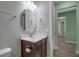 Bathroom features an octagonal mirror above the vanity with a white countertop at 8724 Ocean Tides Cv, Parrish, FL 34219