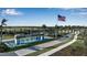 Del Webb Bayview entrance with water feature and an American flag, offering a warm welcome at 8724 Ocean Tides Cv, Parrish, FL 34219