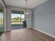 Bright dining area with large sliding glass doors, seamlessly connecting indoor and outdoor living spaces at 8724 Ocean Tides Cv, Parrish, FL 34219