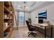Modern home office with custom built-in shelving, warm lighting, and cozy desk space at 8724 Ocean Tides Cv, Parrish, FL 34219