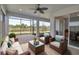 Screened-in patio with comfortable seating offering views of the backyard's natural landscape at 8724 Ocean Tides Cv, Parrish, FL 34219