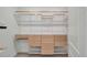Walk-in closet with custom shelving and cabinetry at 8724 Ocean Tides Cv, Parrish, FL 34219