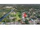 Sprawling aerial view showcasing the home's location near lush greenery and waterways at 9048 94Th St, Seminole, FL 33777