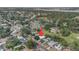 Aerial view of a property with a pool, surrounded by trees and situated in a tranquil neighborhood setting at 9048 94Th St, Seminole, FL 33777