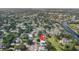 Aerial view of a beautiful, quiet neighborhood, showcasing lush trees and its proximity to a serene river at 9048 94Th St, Seminole, FL 33777