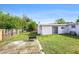 View of the home's backyard with a grill and patio, offering plenty of space for outdoor activities at 9048 94Th St, Seminole, FL 33777