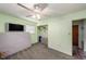 Bedroom featuring bright walls, built-in closet, and a mounted TV at 9048 94Th St, Seminole, FL 33777