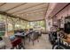 Enclosed patio featuring outdoor seating and strung lighting, ideal for entertaining and enjoying the outdoors at 9048 94Th St, Seminole, FL 33777