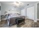 Bedroom featuring wood-look flooring, a ceiling fan, and a closet at 917 Silver Ridge Way, Valrico, FL 33594