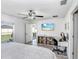 Bright bedroom with an airy desk space, complete with modern fixtures and ample sunlight at 9412 Lemon Drop Loop, Ruskin, FL 33573