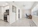 Office area featuring a ceiling fan, bright natural light, and an adjacent kitchen area at 10037 62Nd Ter # 4, St Petersburg, FL 33708