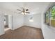 Cozy bedroom with plush carpeting, ceiling fan, large closet, and ample natural light at 10323 107Th N Ave, Largo, FL 33773