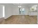 Open dining area featuring vinyl flooring, modern lighting, and glass doors to the backyard at 10323 107Th N Ave, Largo, FL 33773