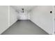 Clean and spacious garage with painted floor and ample room for vehicles at 10323 107Th N Ave, Largo, FL 33773