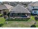 Aerial view of home featuring a screened lanai, pool, and fenced backyard at 11424 Drifting Leaf Dr, Riverview, FL 33579