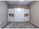 Bedroom featuring a Murphy bed, a ceiling fan, and built-in white cabinets at 11424 Drifting Leaf Dr, Riverview, FL 33579