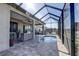 Covered lanai with pool and grill perfect for outdoor cooking and entertaining at 11424 Drifting Leaf Dr, Riverview, FL 33579