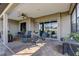 Spacious covered lanai with ample seating, tiled flooring, and a relaxing atmosphere at 11424 Drifting Leaf Dr, Riverview, FL 33579