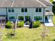 Aerial view of fenced backyard with patio, lawn, and the rear of the home at 11648 Crowned Sparrow Ln, Tampa, FL 33626