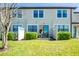 Private fenced backyard offers a tranquil outdoor dining area and lush lawn at 11648 Crowned Sparrow Ln, Tampa, FL 33626