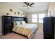 A serene bedroom featuring a vaulted ceiling, a ceiling fan, and large windows for plenty of natural light at 11648 Crowned Sparrow Ln, Tampa, FL 33626