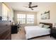 Comfortable bedroom featuring natural light, plush carpet, and ample closet space at 11648 Crowned Sparrow Ln, Tampa, FL 33626