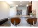 Spacious kitchen island with seating, granite countertops, stainless steel sink, and plenty of cabinet space at 11648 Crowned Sparrow Ln, Tampa, FL 33626