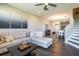 Open concept living room leading into dining area, featuring modern decor and hardwood floors throughout at 11648 Crowned Sparrow Ln, Tampa, FL 33626