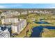 Overhead view of luxurious condo complex with golf course, ponds and mature trees at 1200 Country Club Dr # 2206, Largo, FL 33771