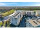 Aerial view of the condominium complex featuring a golf course and pond at 1200 Country Club Dr # 2206, Largo, FL 33771