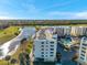 Aerial view of the building and a nearby lake and golf course at 1200 Country Club Dr # 2206, Largo, FL 33771
