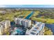 Expansive aerial shot showcasing a multi-story complex and beautiful golf course community at 1200 Country Club Dr # 2206, Largo, FL 33771