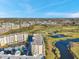 Gorgeous aerial shot of the condo complex with a beautiful golf course and surrounding landscaping at 1200 Country Club Dr # 2206, Largo, FL 33771